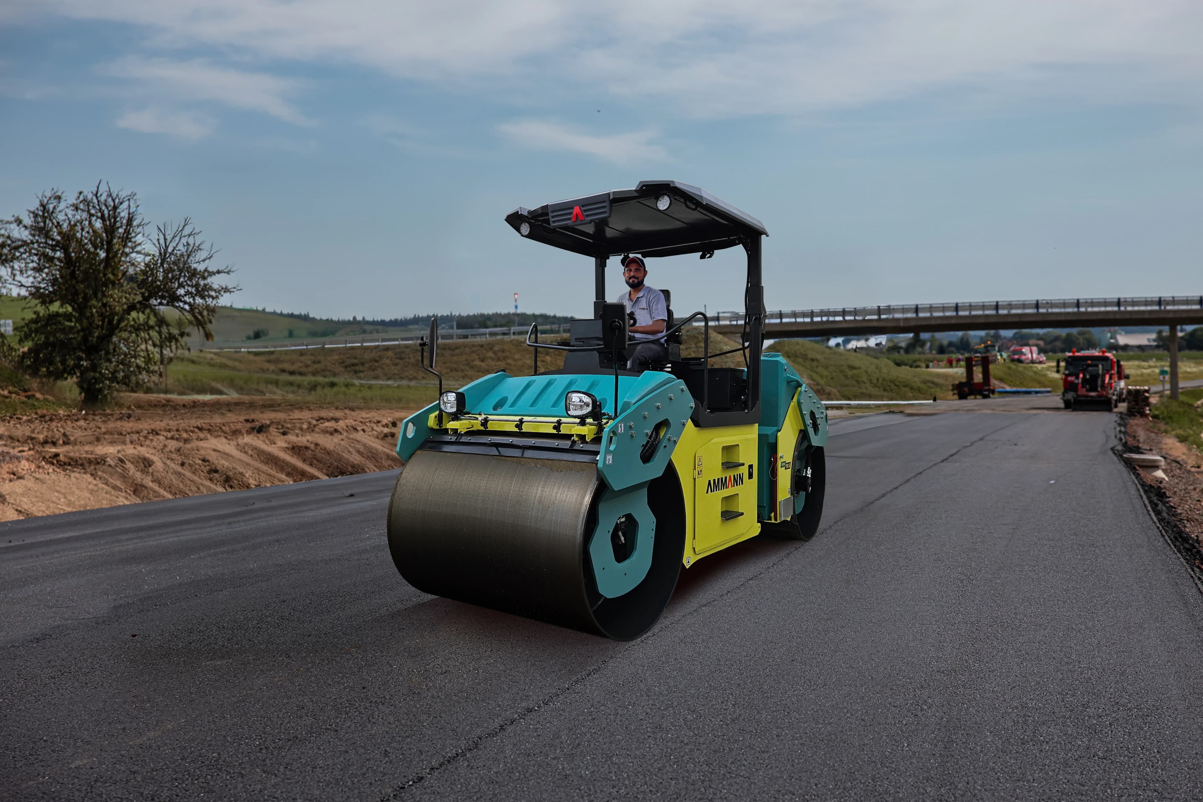 Ammann ARX articulated tandem roller compacting asphalt on a jobsite